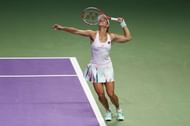 SINGAPORE - OCTOBER 23:  Angelique Kerber of Germany serves in her singles match against Dominika Cibulkova of Slovakia during day 1 of the BNP Paribas WTA Finals Singapore at Singapore Sports Hub on October 23, 2016 in Singapore.  (Photo by Julian Finney/Getty Images)